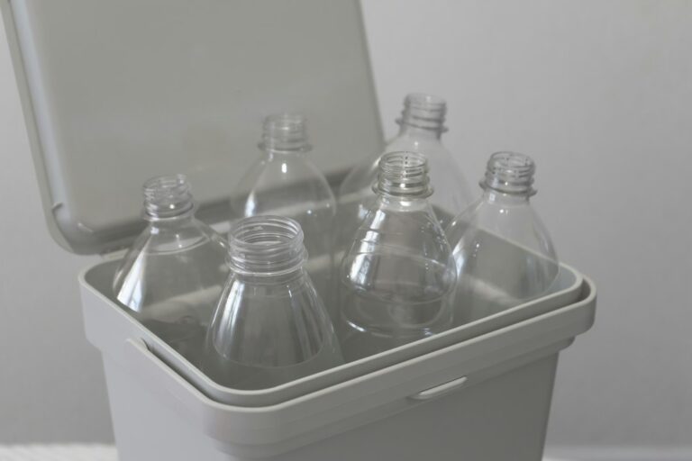Plastic bottle being sorted for recycling, illustrating household waste separation.