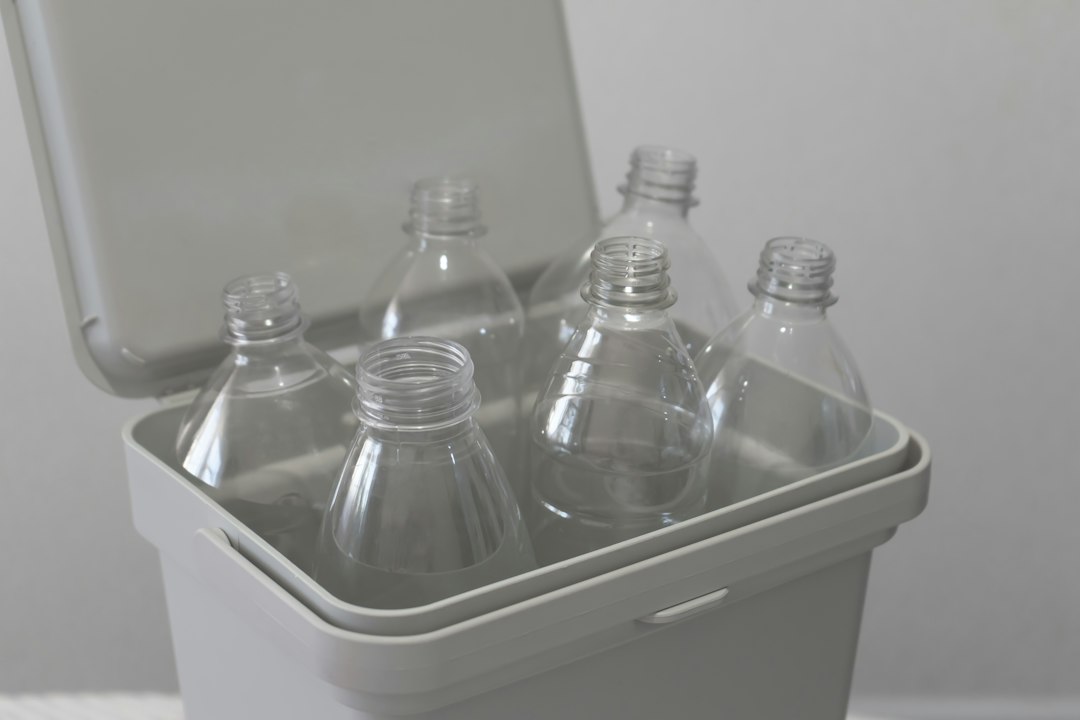 Plastic bottle being sorted for recycling, illustrating household waste separation.