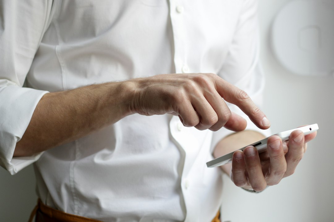 Smartphone use illustrating online safety and scam awareness